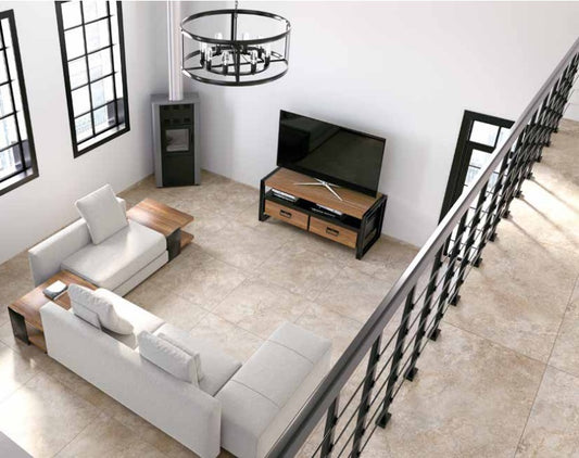 Tuscania Dolomia Stone 'Almond', beige natuursteenlook vloertegels in een woonkamer met witte hoekbank en trapleuning