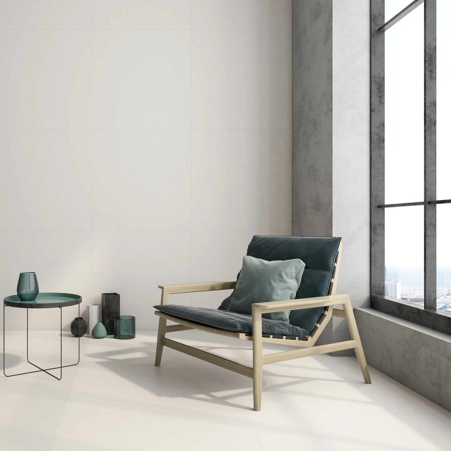 Argenta Cerámica Carpenter 'Albar', crèmekleurige vloer- en wandtegels in een loft met houten fauteuil bij een hoog raam