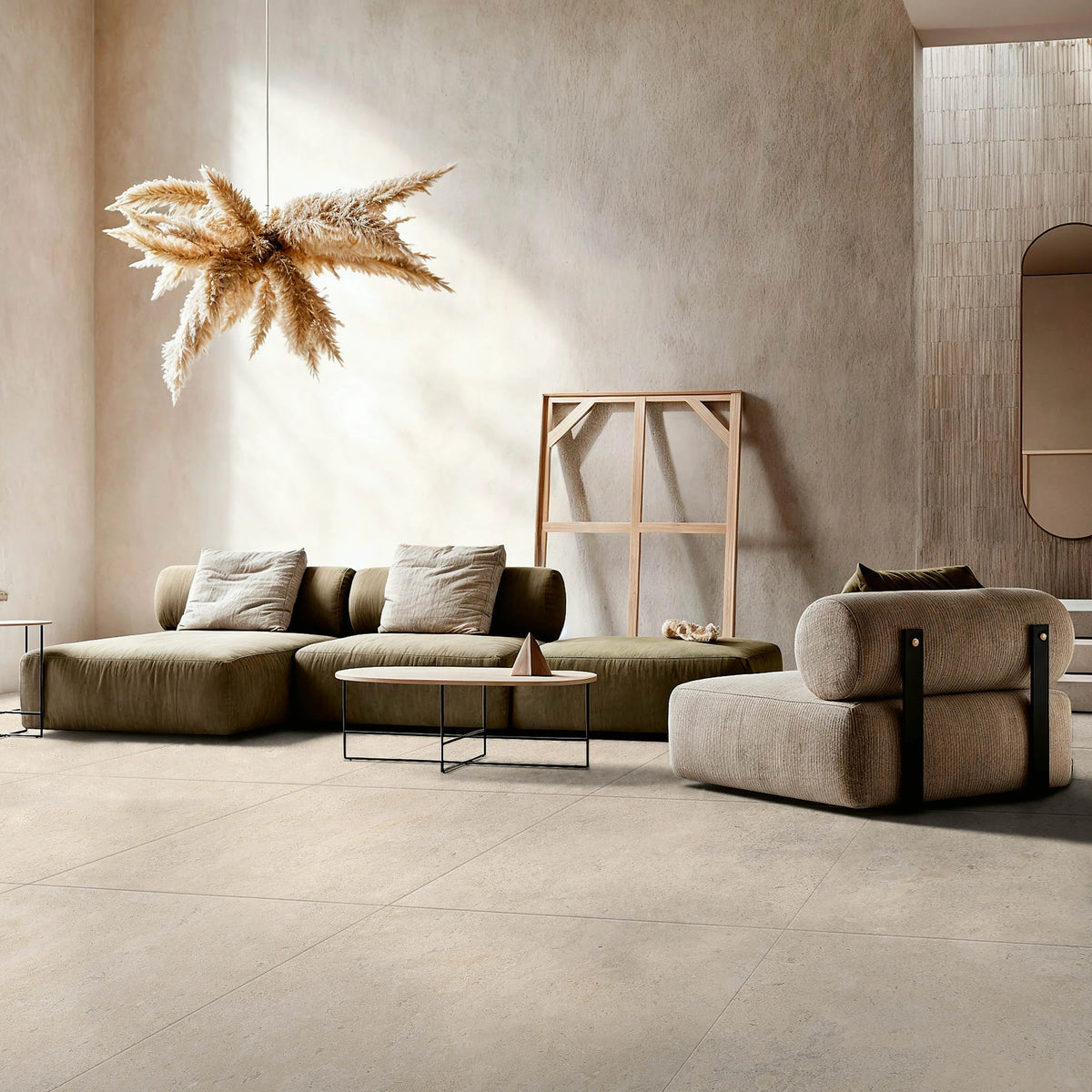 EnergieKer Heritage 'Cedar', hier als taupe vloertegels 120x120cm in een lichte woonkamer met groene bank