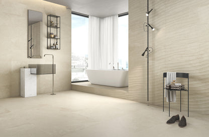 Keraben Mixit 'Beige', beige tegels op vloer en wand in een badkamer met vrijstaand bad bij het raam