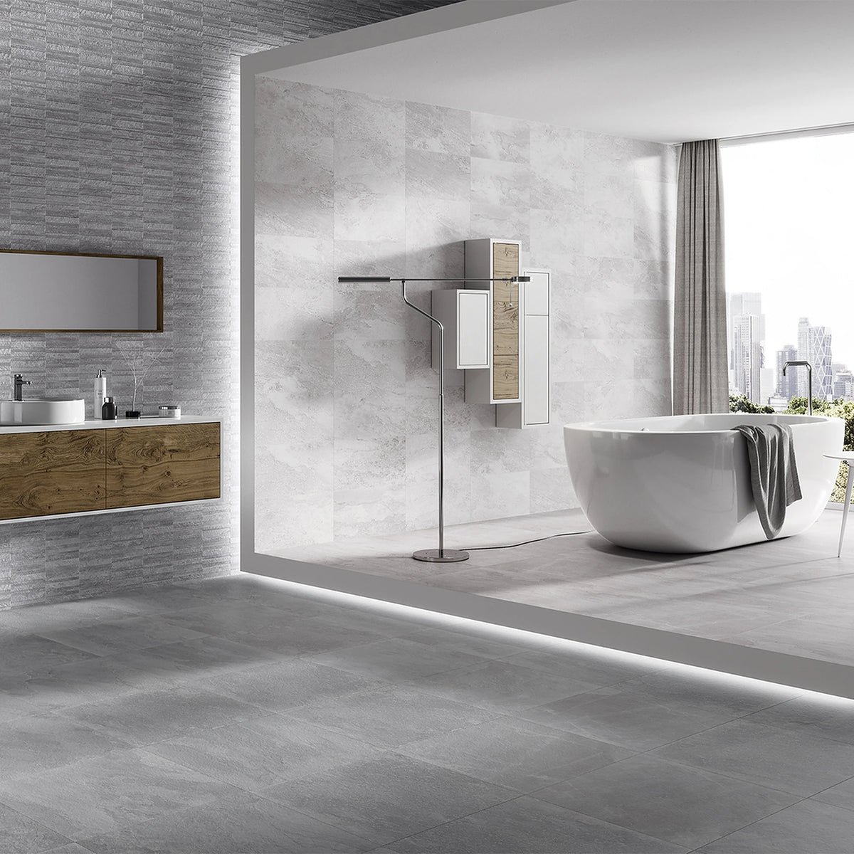 Keraben Nature 'Grey', grijze vloertegels in een badkamer met vrijstaand bad, wand in een andere kleur